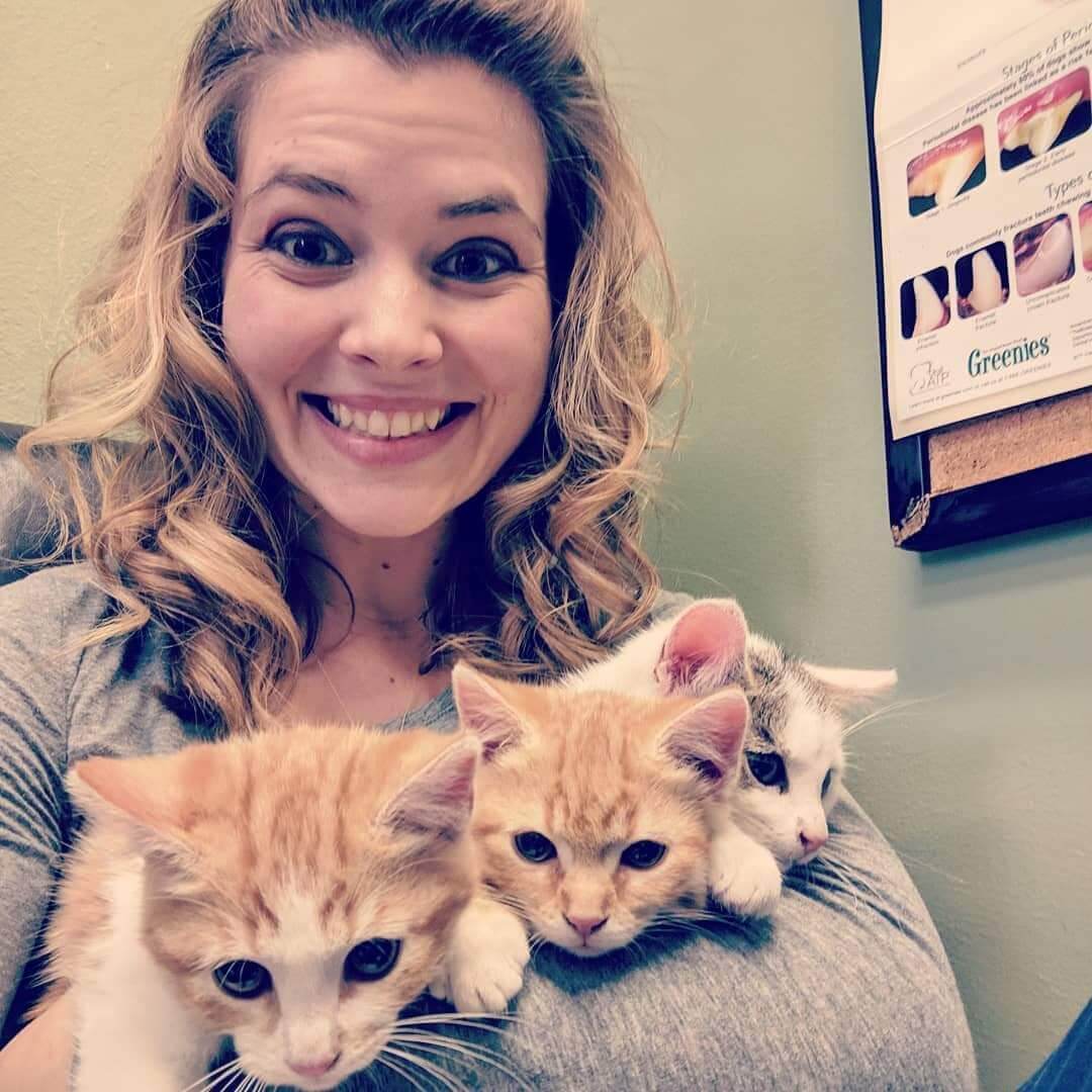 Woman holding kittens